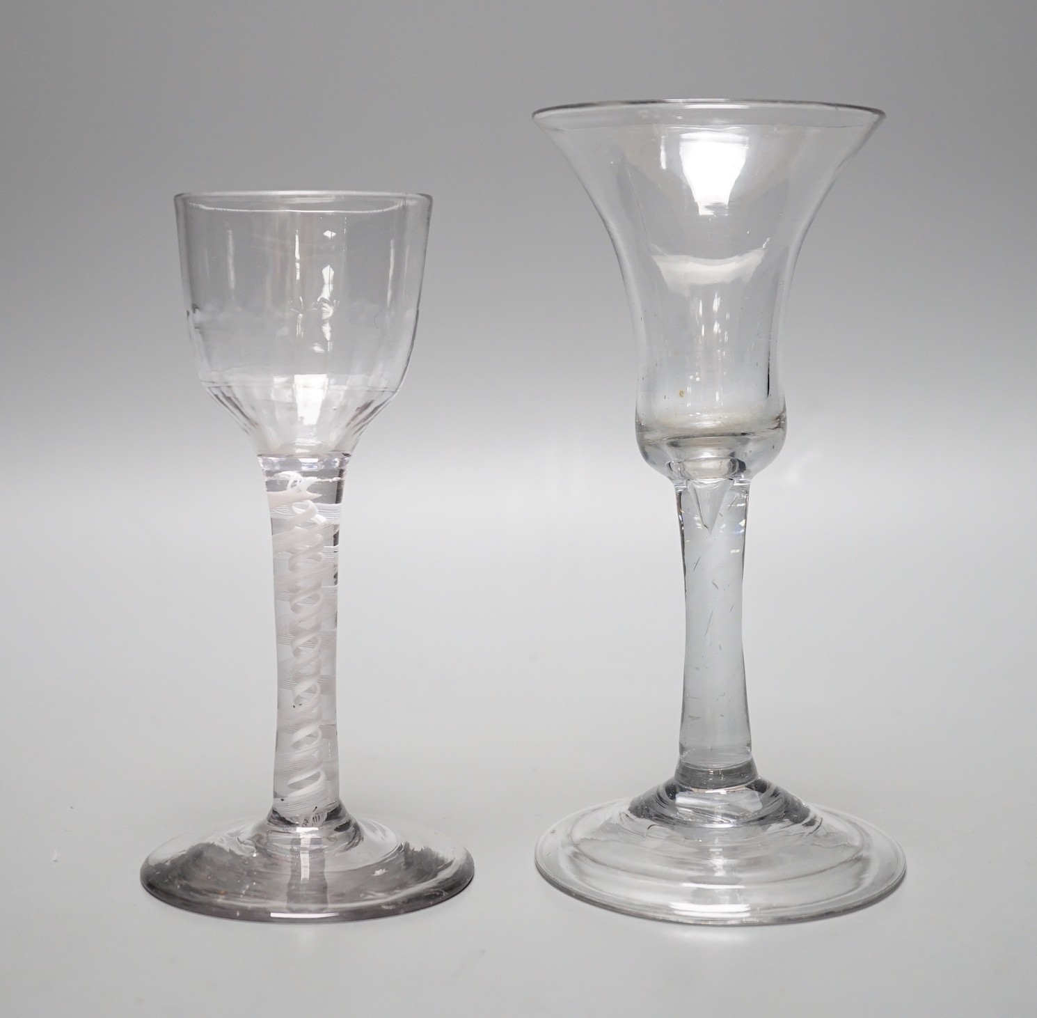A George III dsot stem wine glass and a George II wine glass with folded foot, tallest 15.5cm